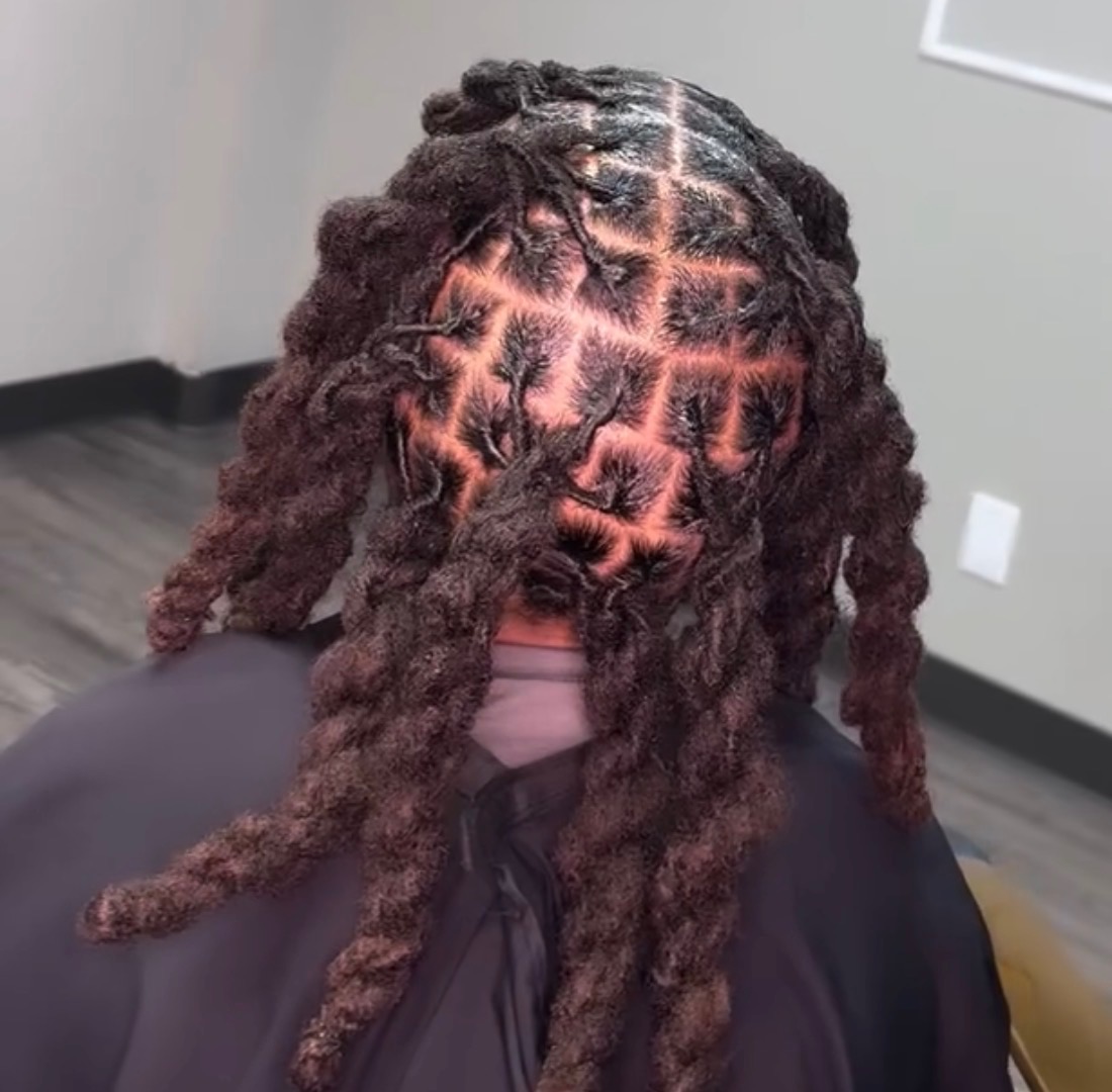 Dreadlock hairstyle with geometric crown pattern