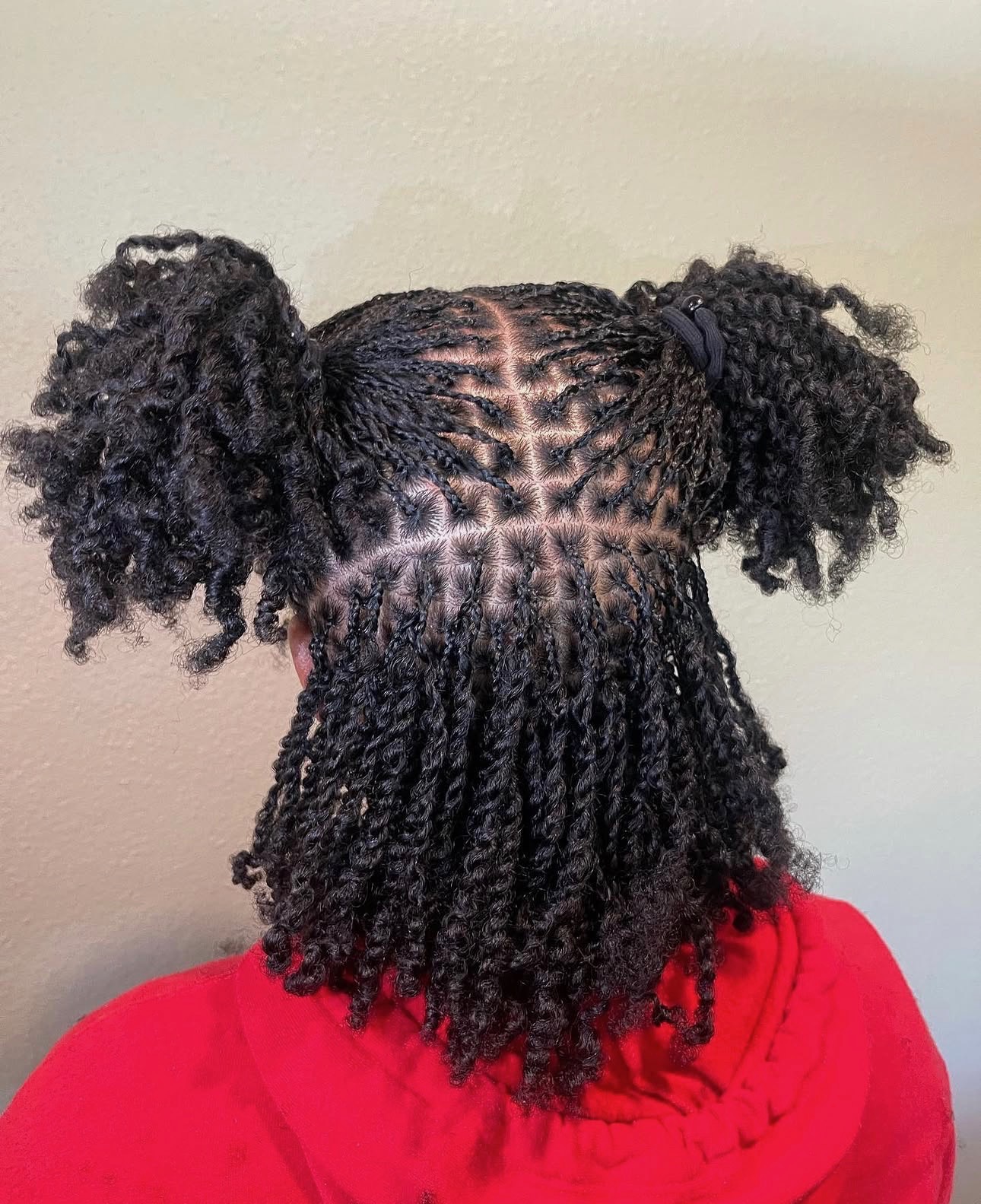 Young client with neat braids, outdoor portrait