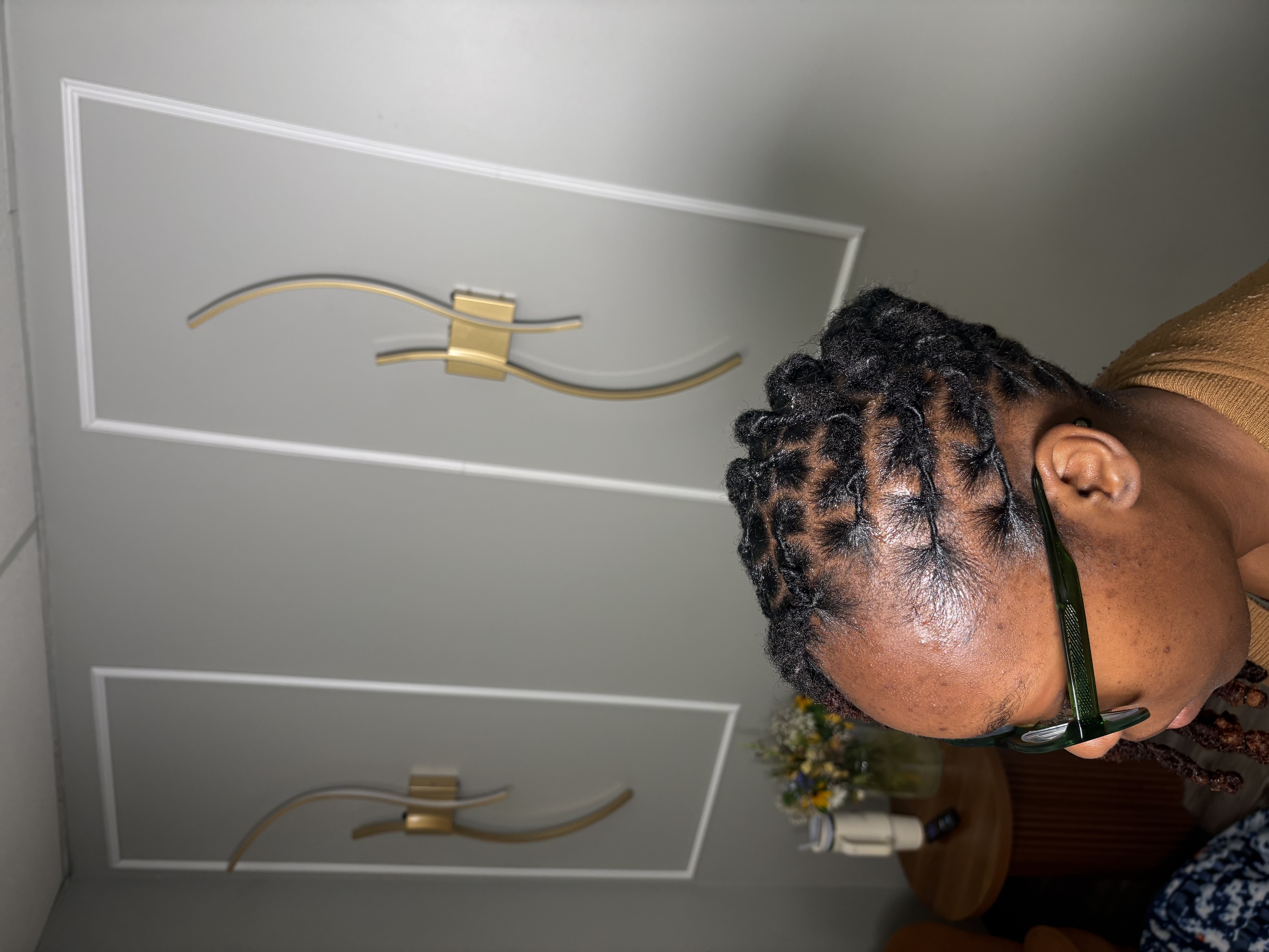 Dark brown box braids in crisscross pattern